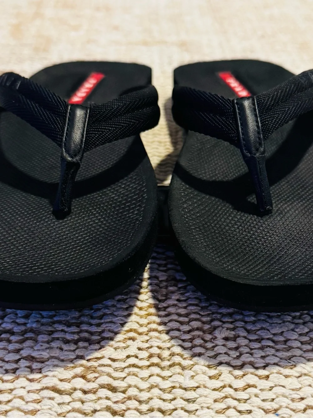 Prada Black Flip-Flop Sandals with Red Logo Accents